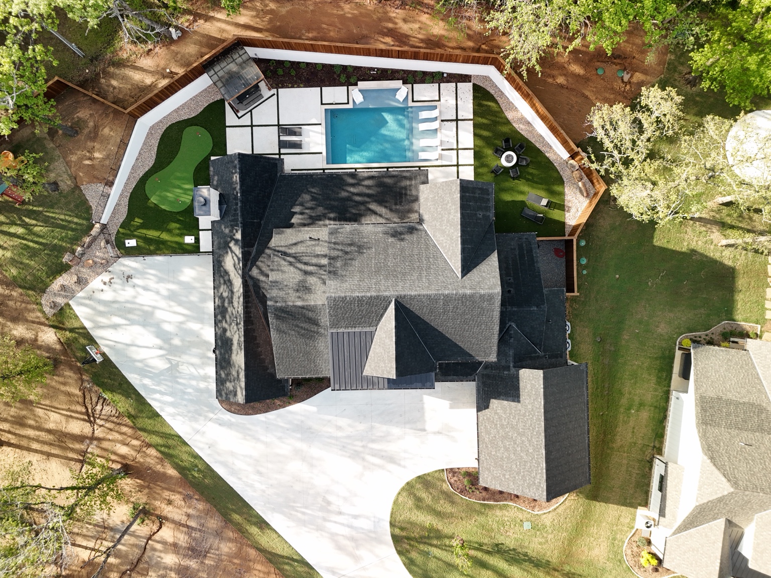 Overhead property view showing home, pool and lot layout